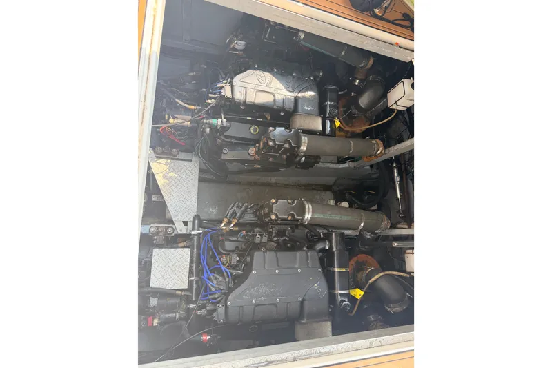 Slide: The Image of Engine compartment of a 2001 Sea Ray 380 Sundancer boat, showcasing dual engines. - 5