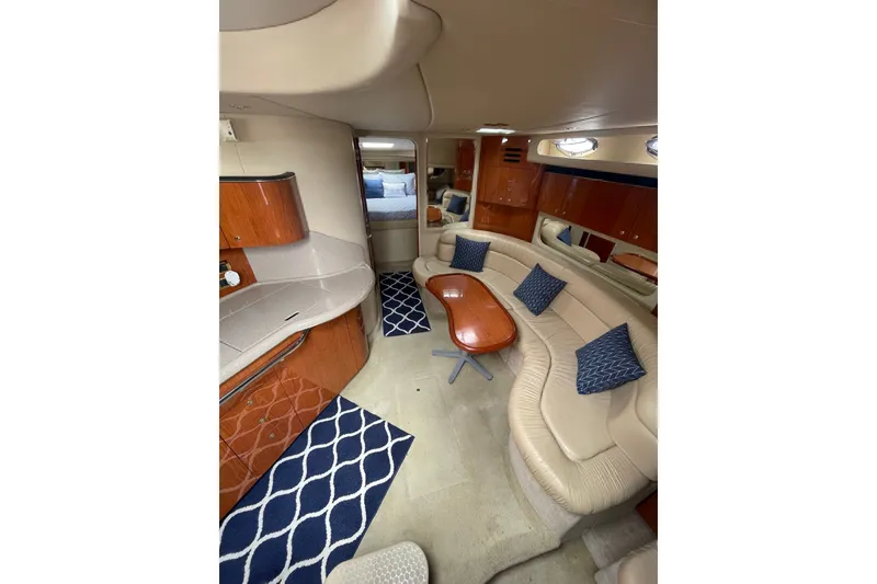 Slide: The Image of Luxurious interior of 2001 Sea Ray 380 Sundancer yacht with elegant seating and modern design. - 17