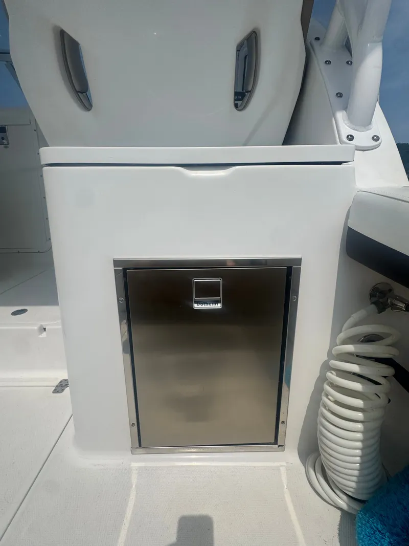 Slide: The Image of A stainless steel cabinet on a 2018 Edgewater 280CX Crossover boat. - 19