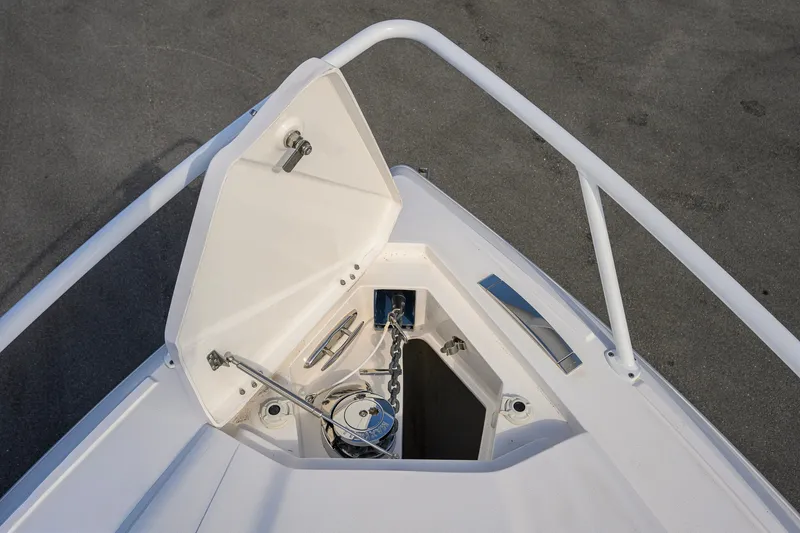 Slide: The Image of Bow anchor compartment of 2022 Intrepid 409 Valor boat, featuring stainless steel fittings. - 8