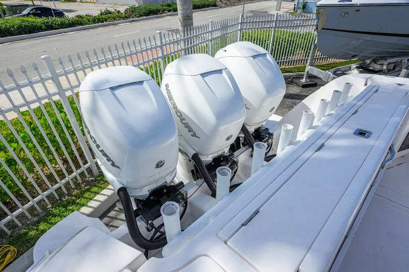 Slide: The Image of Triple Mercury outboard engines on a 2022 Intrepid 409 Valor boat. - 55