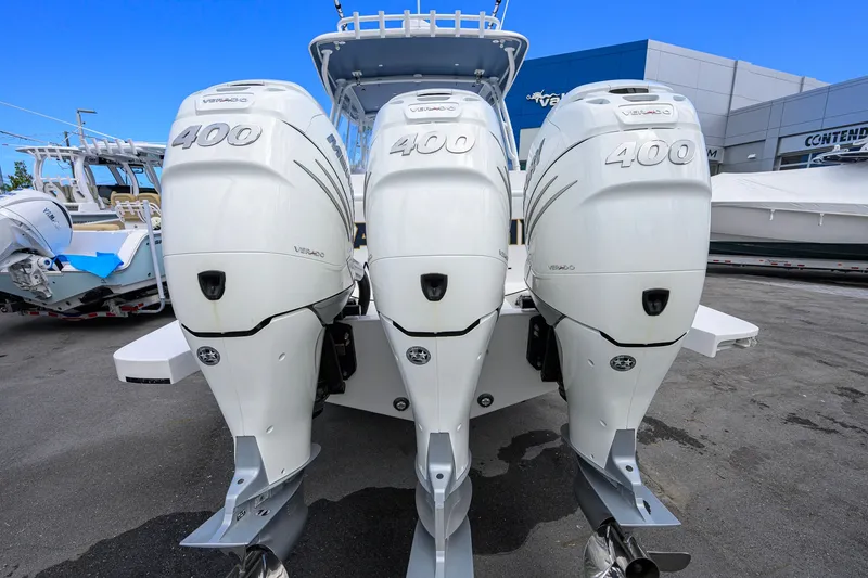 Slide: The Image of Triple Mercury Verado 400 outboard engines on a 2022 Intrepid 409 Valor boat. - 56