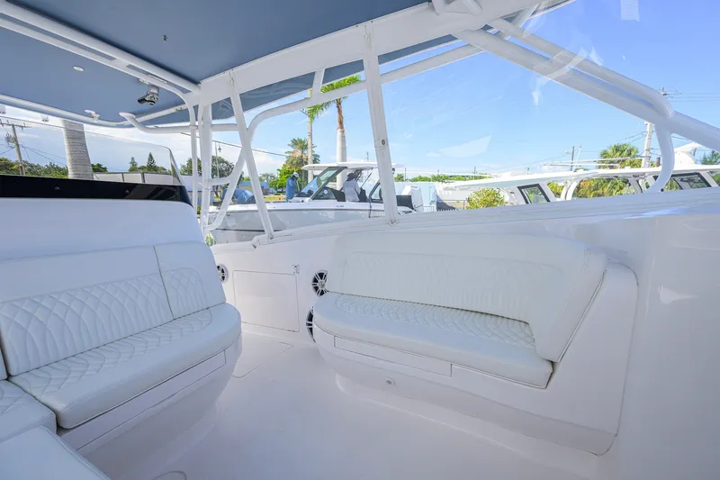 Slide: The Image of Luxurious interior of 2022 Intrepid 409 Valor boat with white seating and sleek design. - 26