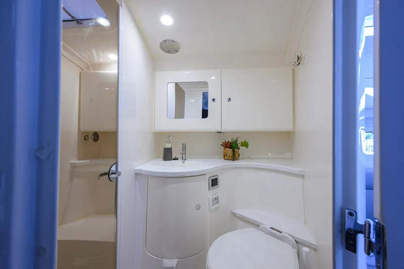 Slide: The Image of Luxurious bathroom interior of 2022 Intrepid 409 Valor yacht, featuring modern fixtures and elegant design. - 69
