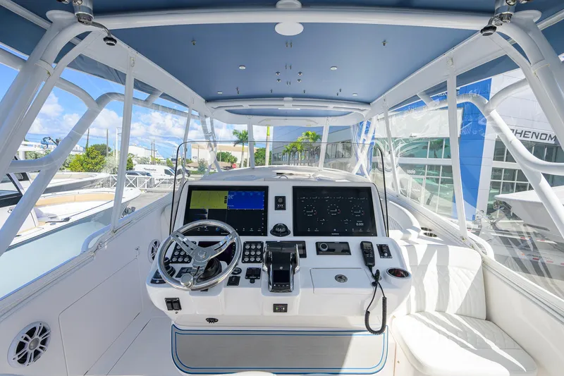 Slide: The Image of Interior view of 2022 Intrepid 409 Valor boat cockpit with modern navigation equipment. - 17