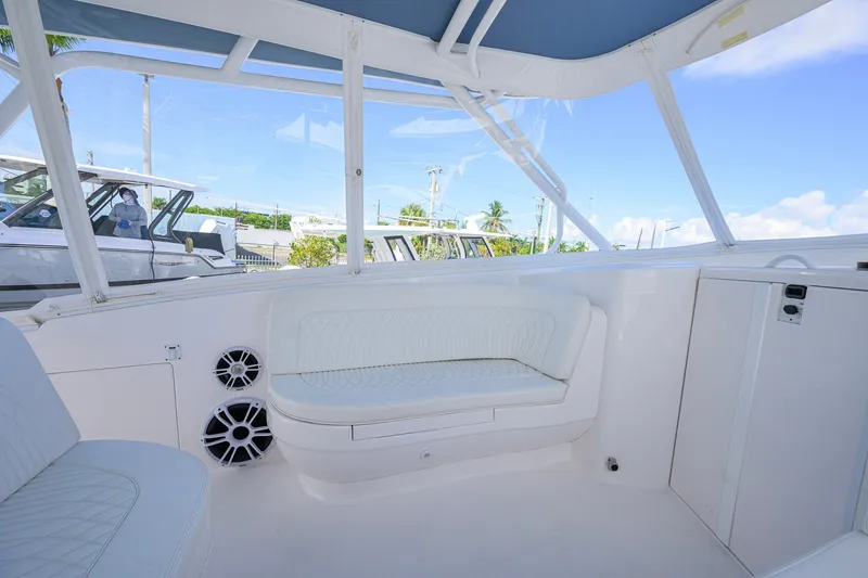 Slide: The Image of 2022 Intrepid 409 Valor boat interior with white seating and speakers. - 25
