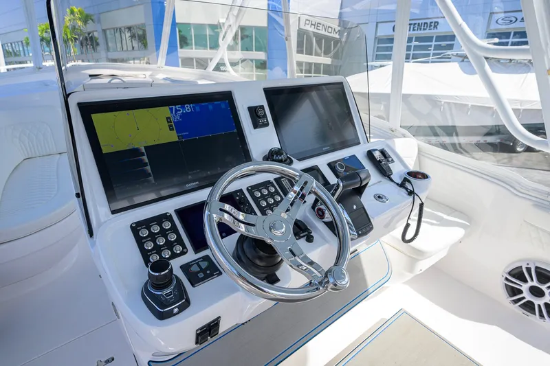 Slide: The Image of 2022 Intrepid 409 Valor helm with dual screens and modern controls. - 16