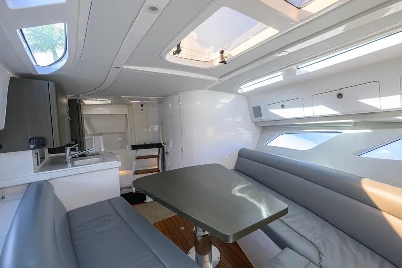 Slide: The Image of Luxurious interior of 2022 Intrepid 409 Valor yacht with modern seating and skylights. - 61