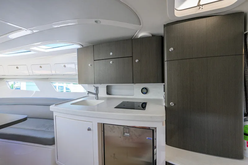 Slide: The Image of Modern kitchen interior of 2022 Intrepid 409 Valor yacht with sleek cabinetry and seating. - 67