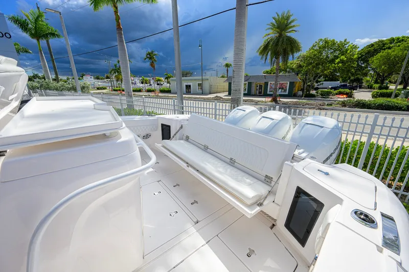 Slide: The Image of 2022 Intrepid 409 Valor boat deck with seating and outboard motors. - 32