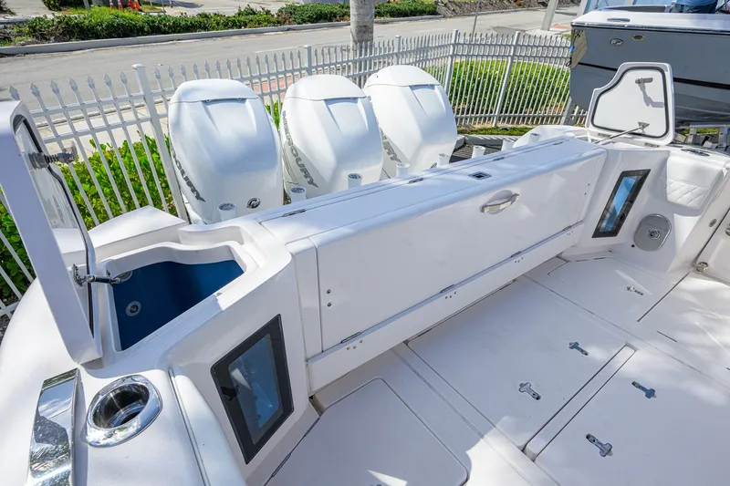 Slide: The Image of 2022 Intrepid 409 Valor boat deck with triple Mercury outboard engines. - 52