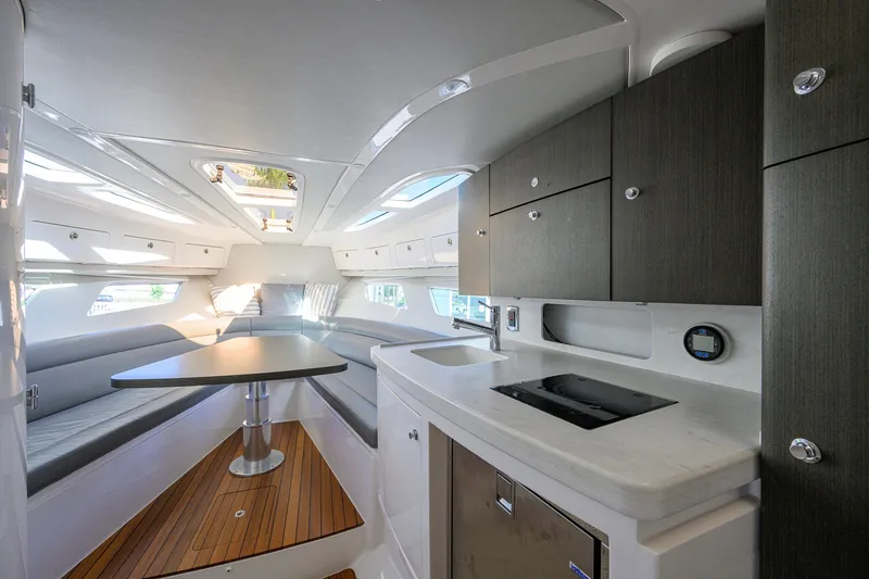 Slide: The Image of Luxurious interior of 2022 Intrepid 409 Valor yacht with modern kitchen and seating area. - 68