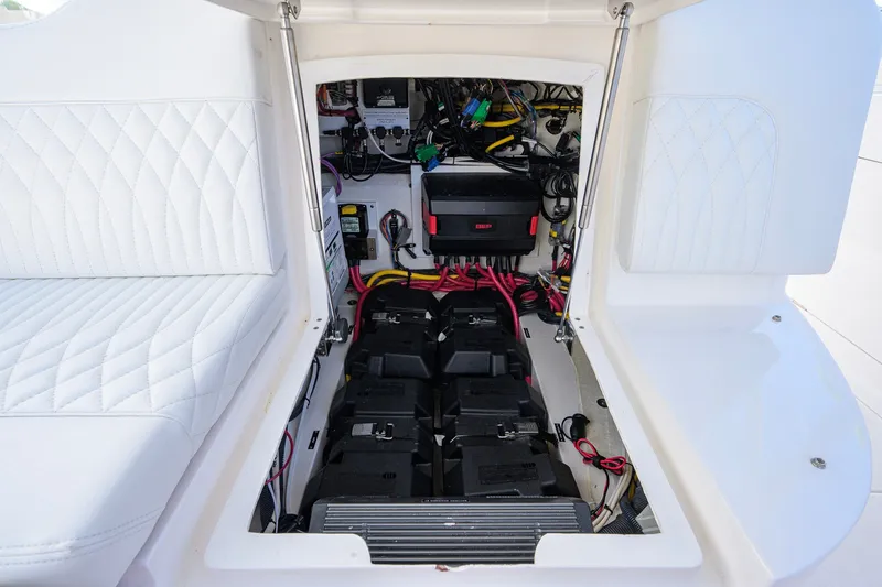 Slide: The Image of 2022 Intrepid 409 Valor boat electrical compartment with batteries and wiring. - 22