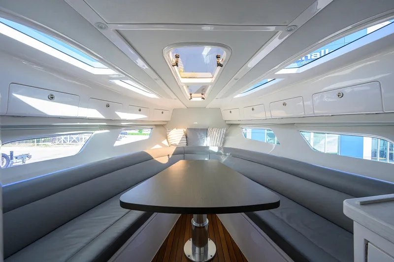 Slide: The Image of Interior of 2022 Intrepid 409 Valor yacht with sleek seating and modern design. - 59
