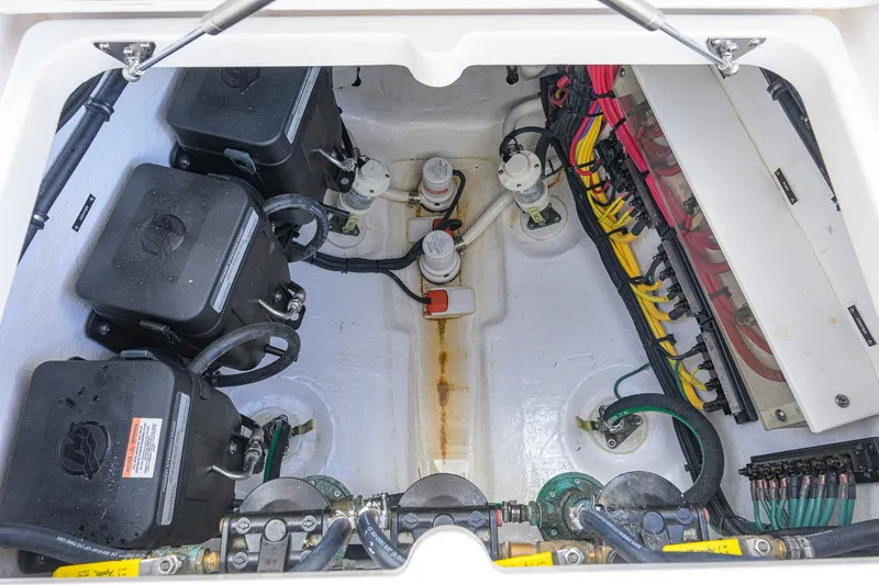 Slide: The Image of Engine compartment of 2022 Intrepid 409 Valor boat, showcasing wiring and components. - 50