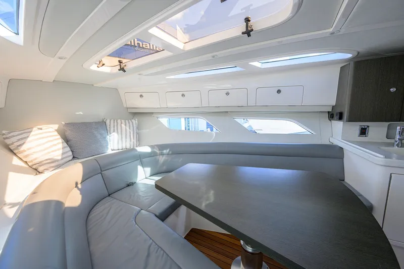 Slide: The Image of Interior of 2022 Intrepid 409 Valor yacht with seating and table. - 64