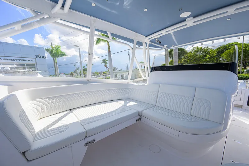 Slide: The Image of Luxurious seating area on 2022 Intrepid 409 Valor boat, featuring white quilted upholstery. - 27