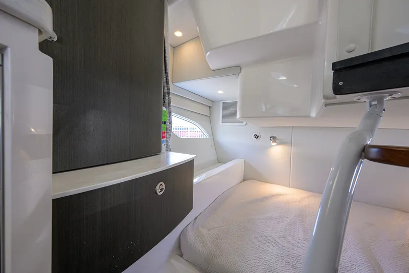 Slide: The Image of Interior cabin of 2022 Intrepid 409 Valor boat, featuring modern design and cozy sleeping area. - 72