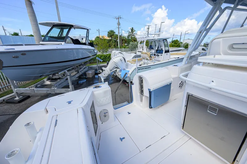 Slide: The Image of 2022 Intrepid 409 Valor boat docked, showcasing sleek design and modern features. - 42
