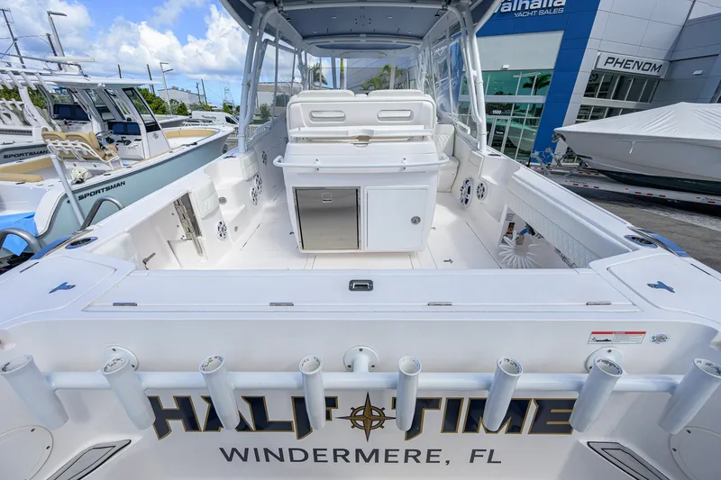 Slide: The Image of 2022 Intrepid 409 Valor boat at dealership, featuring spacious deck and modern design. - 36