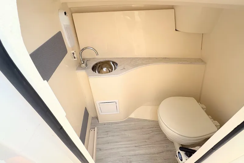 Slide: The Image of 2022 Scout 240 Dorado boat bathroom with sink and toilet. - 17