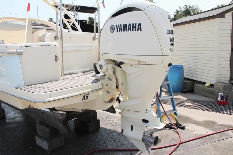Slide: The Image of 2022 Scout 240 Dorado with Yamaha 300 V6 outboard motor on a dock. - 20