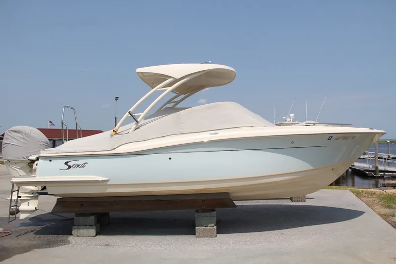 Slide: The Image of 2022 Scout 240 Dorado boat on display at a marina. - 21