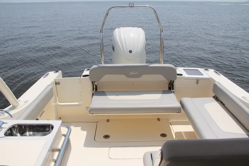Slide: The Image of 2022 Scout 240 Dorado boat interior with seating, ocean view, and sleek design. - 13