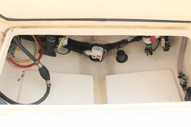 Slide: The Image of 2022 Scout 240 Dorado boat compartment with hoses and wiring. - 19