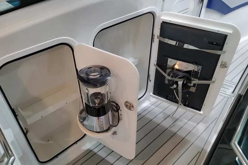 Slide: The Image of 2027 Formula 430 Super Sport Crossover yacht with built-in coffee maker in storage compartment. - 14