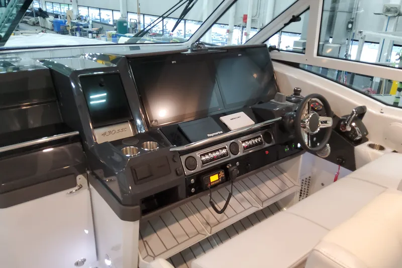 Slide: The Image of 2027 Formula 430 Super Sport Crossover cockpit with advanced navigation and control systems. - 16