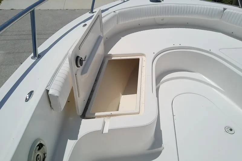 Slide: The Image of 2004 Stamas 310 Tarpon boat with open storage compartment on deck. - 33