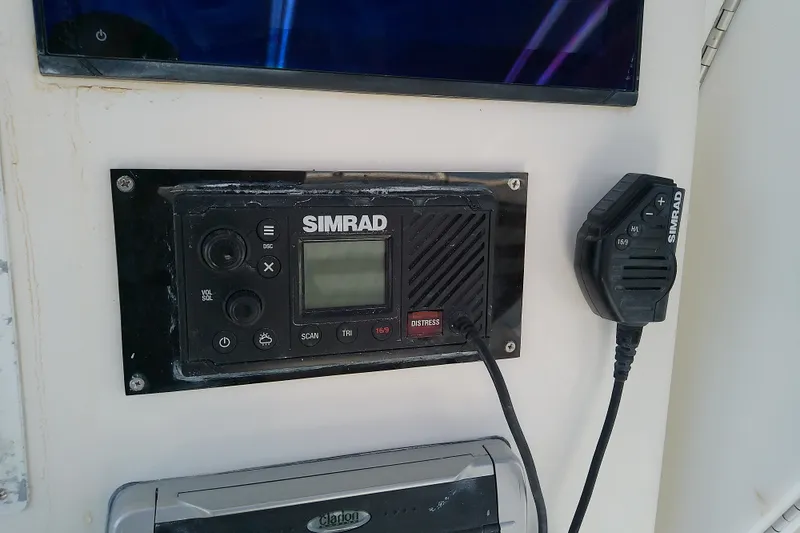 Slide: The Image of Simrad marine radio system on 2004 Stamas 310 Tarpon boat dashboard. - 40