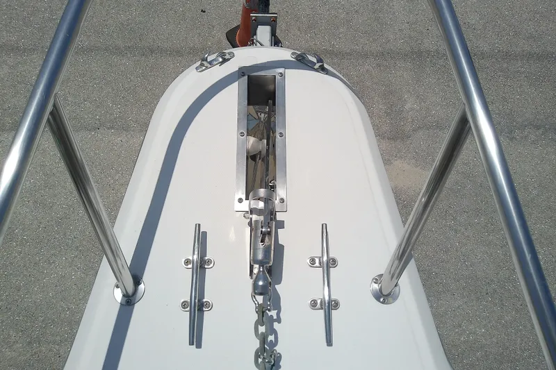 Slide: The Image of Bow view of 2004 Stamas 310 Tarpon boat with anchor chain and cleats. - 29