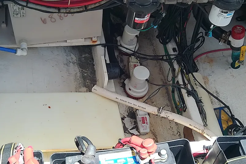 Slide: The Image of 2004 Stamas 310 Tarpon boat interior showing wiring and mechanical components. - 52