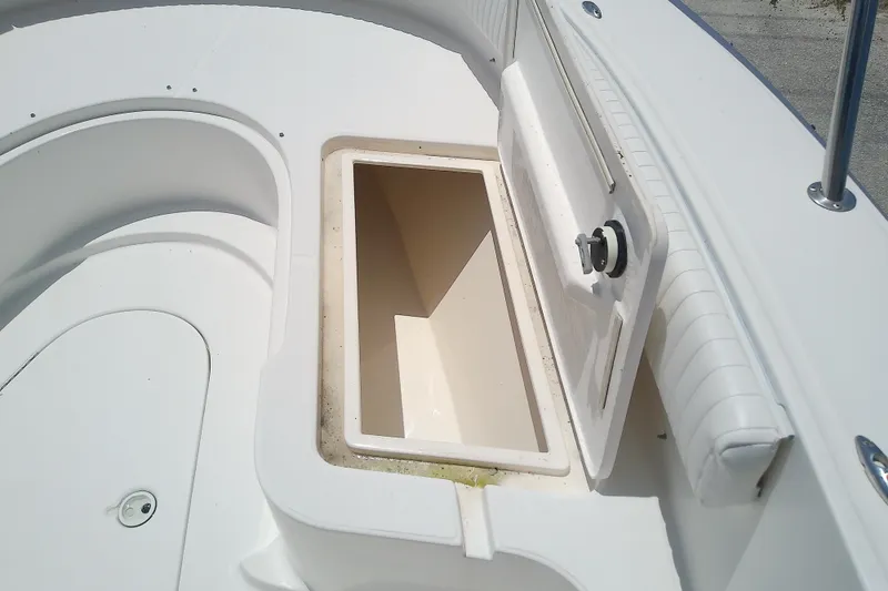 Slide: The Image of Open storage compartment on a 2004 Stamas 310 Tarpon boat deck. - 34