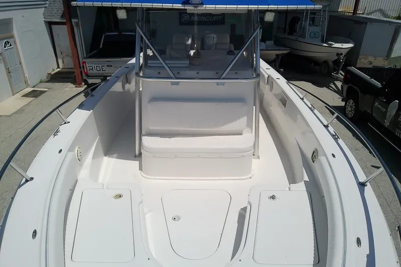 Slide: The Image of 2004 Stamas 310 Tarpon boat deck with seating and storage compartments. - 30