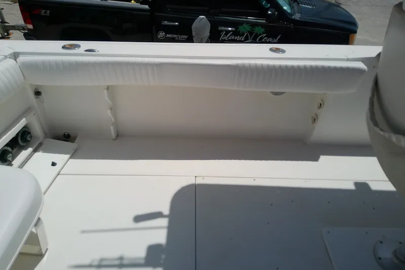 Slide: The Image of 2004 Stamas 310 Tarpon boat interior with white seating and deck. - 25