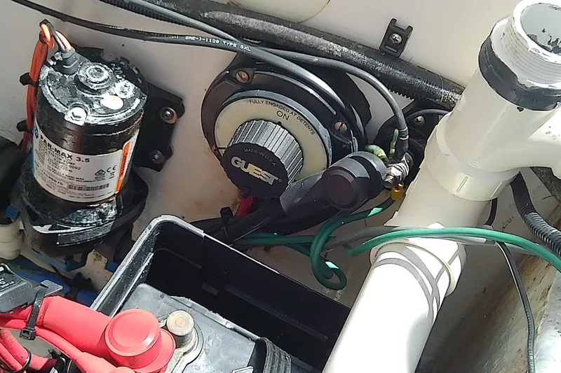 Slide: The Image of Electrical components and wiring inside a 2004 Stamas 310 Tarpon boat. - 56