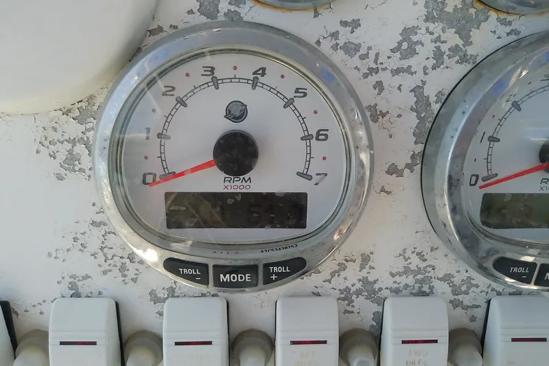 Slide: The Image of Close-up of RPM gauges on a 2004 Stamas 310 Tarpon boat dashboard. - 43