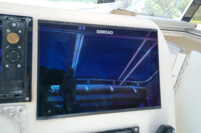 Slide: The Image of Simrad display on 2004 Stamas 310 Tarpon boat dashboard. - 39