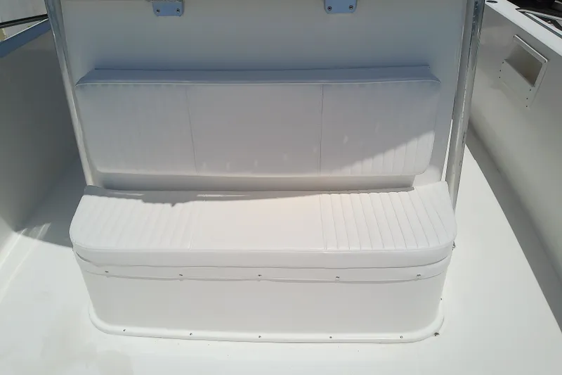 Slide: The Image of White cushioned seating on 2004 Stamas 310 Tarpon boat deck. - 35