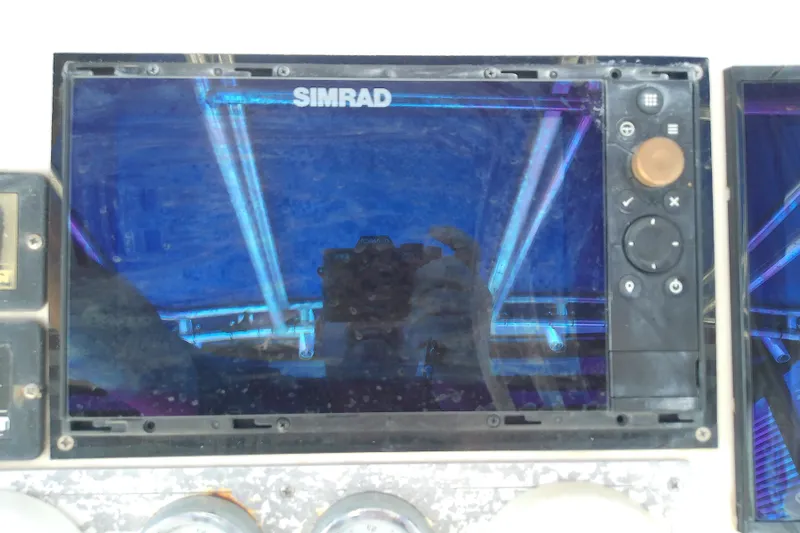 Slide: The Image of Simrad marine display on 2004 Stamas 310 Tarpon boat dashboard. - 38