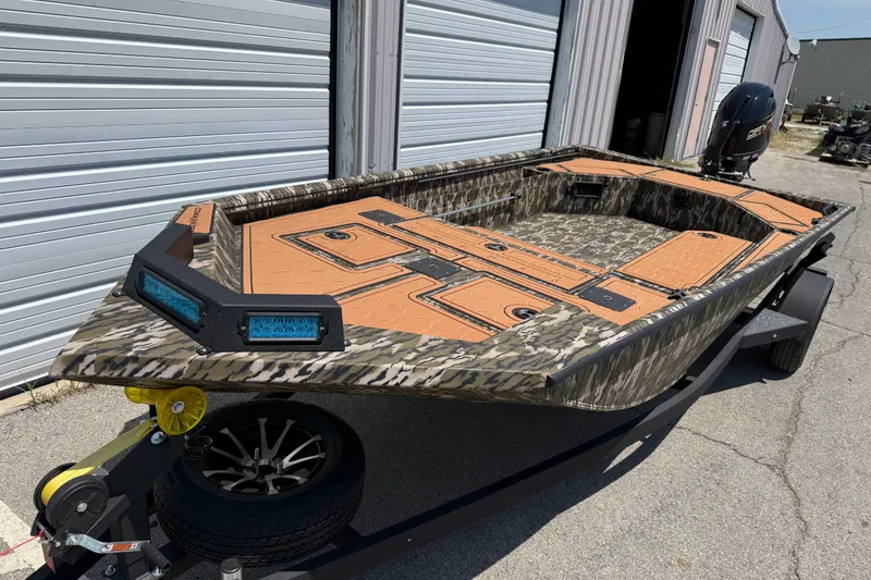 Slide: The Image of 2027 Avid 18 Commander boat with camouflage design on a trailer. - 5