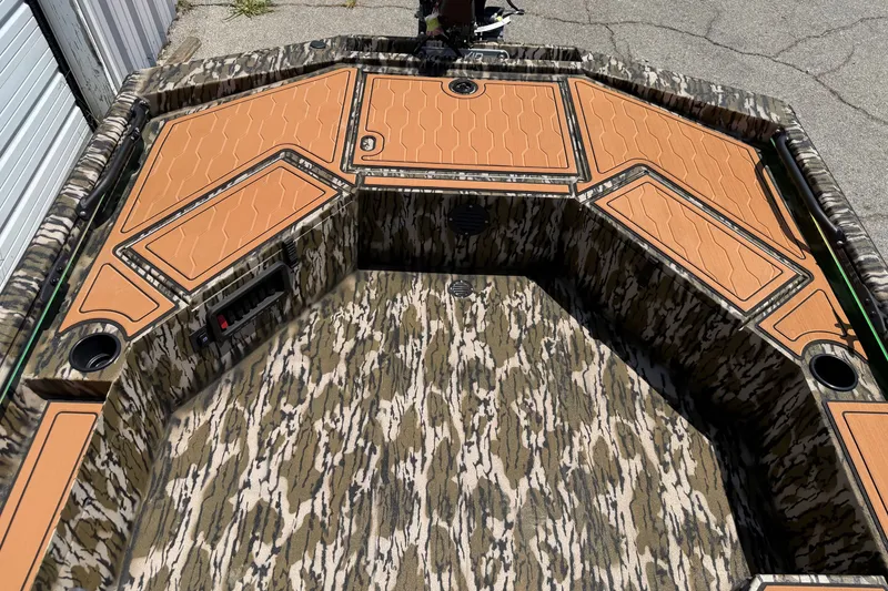 Slide: The Image of 2027 Avid 18 Commander boat with camo pattern and orange deck panels. - 11