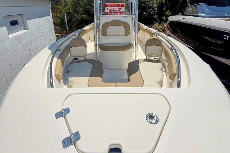 Slide: The Image of 2019 Key West 203 FS boat interior with beige seating and stainless steel railings. - 4