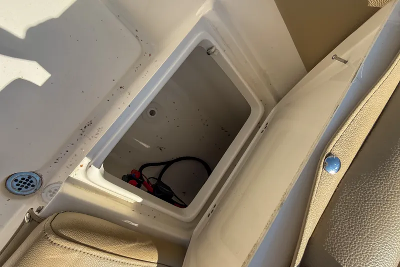 Slide: The Image of Open storage compartment on 2019 Key West 203 FS boat, showing interior details. - 8