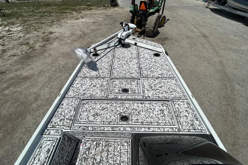 Slide: The Image of 2023 Crestliner 1600 Storm boat deck with camo pattern and mounted equipment. - 7