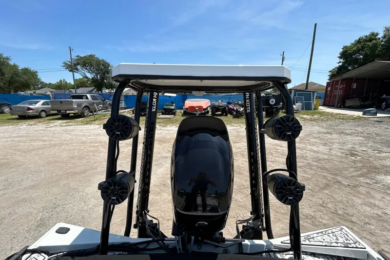 Slide: The Image of 2023 Crestliner 1600 Storm boat with motor and speakers, parked outdoors. - 8