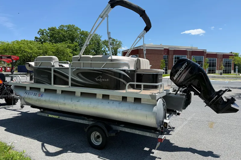 The Image of 2018 Qwest 7516 SC pontoon boat on trailer with Mercury outboard motor. - 0